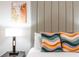 Bedroom showcasing a bed with colorful pillows and a stylish headboard at 4001 Breakview Dr # D409, Orlando, FL 32819