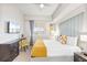Bright bedroom features a ceiling fan, a desk, and a decorative headboard at 4001 Breakview Dr # D409, Orlando, FL 32819