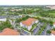 A well-maintained building with terracotta roofs, manicured lawns, ample parking, and lush greenery at 4001 Breakview Dr # D409, Orlando, FL 32819