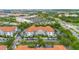 A well-maintained building featuring a terracotta-tiled roof, manicured landscaping, and a convenient parking area at 4001 Breakview Dr # D409, Orlando, FL 32819