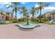 Beautiful water fountain surrounded by palm trees and lush landscaping at 4001 Breakview Dr # D409, Orlando, FL 32819