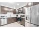 Modern kitchen features stainless steel appliances and sleek countertops at 4001 Breakview Dr # D409, Orlando, FL 32819