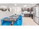Well-lit kitchen features stainless steel appliances, dark cabinets, and dining area at 4001 Breakview Dr # D409, Orlando, FL 32819