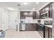 Modern kitchen with stainless steel appliances and white subway tile backsplash at 4001 Breakview Dr # D409, Orlando, FL 32819