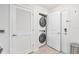 Laundry area equipped with a stacked washer and dryer at 4001 Breakview Dr # D409, Orlando, FL 32819