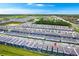 Aerial view of a community showcasing numerous homes, green spaces, and well-planned street layouts at 4021 Lana Ave, Davenport, FL 33897
