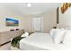 Inviting bedroom with a soft bed, white linens, dresser, and a wall-mounted TV for ultimate relaxation at 4021 Lana Ave, Davenport, FL 33897