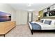Inviting bedroom with a comfortable bed, natural lighting, and warm decor at 4021 Lana Ave, Davenport, FL 33897