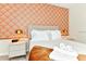 Cozy bedroom with decorative wallpaper and comfortable bedding at 4021 Lana Ave, Davenport, FL 33897