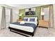 Cozy bedroom with bridge artwork, comfy bed and side tables for relaxing comfort at 4021 Lana Ave, Davenport, FL 33897