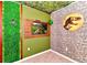 Unique bedroom featuring a dinosaur theme, rock wall and mounted television at 4021 Lana Ave, Davenport, FL 33897