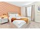 Bright bedroom with king bed, patterned accent wall, and neutral decor at 4021 Lana Ave, Davenport, FL 33897