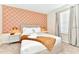 Bedroom featuring patterned wallpaper, a king bed, and bright windows at 4021 Lana Ave, Davenport, FL 33897