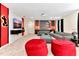 Living room featuring a large gray sectional and fun Mickey Mouse decor at 4021 Lana Ave, Davenport, FL 33897