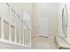 Entry way with white staircase, marble style wall paper, and a bench near the front door at 4021 Lana Ave, Davenport, FL 33897
