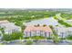 Overhead shot of condo building near lake and highway, showcasing surroundings with lush greenery and nearby amenities at 4114 Breakview Dr # 110, Orlando, FL 32819