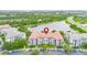 Overhead shot of condo building near lake and highway, showcasing surroundings with lush greenery and nearby amenities at 4114 Breakview Dr # 110, Orlando, FL 32819