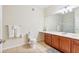 Bathroom features a large vanity, neutral tile flooring, and glass-enclosed shower at 4114 Breakview Dr # 110, Orlando, FL 32819