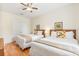 Bright bedroom features 2 beds, wood floors, and ample storage at 4114 Breakview Dr # 110, Orlando, FL 32819