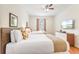 Bright bedroom features 2 beds, wood floors, and flat screen TV at 4114 Breakview Dr # 110, Orlando, FL 32819