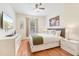 Comfortable bedroom features queen bed, wood floors, and flat screen TV at 4114 Breakview Dr # 110, Orlando, FL 32819
