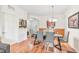Elegant dining room features modern gray chairs, hardwood floors, and a stylish chandelier at 4114 Breakview Dr # 110, Orlando, FL 32819