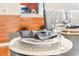 Table setting details include a clear wine glass, napkin, and plate, adding to the dining experience at 4114 Breakview Dr # 110, Orlando, FL 32819
