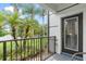 Covered patio with metal railing and manicured garden and landscaping at 4114 Breakview Dr # 110, Orlando, FL 32819