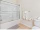 Clean bathroom features glass-enclosed shower, tiled flooring, and fluffy towels at 4114 Breakview Dr # 110, Orlando, FL 32819