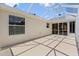 Backyard patio with screened-in enclosure and ample outdoor space for entertaining at 449 Timmonsville Way, The Villages, FL 32162