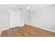 Bedroom offers hardwood floors, ceiling fan, closet and white trim at 449 Timmonsville Way, The Villages, FL 32162