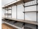 Custom walk-in closet featuring adjustable shelving, hanging rods, and storage baskets at 449 Timmonsville Way, The Villages, FL 32162