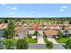 Aerial view of a golf community with beautiful homes and well-maintained landscaping at 449 Timmonsville Way, The Villages, FL 32162