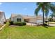 Inviting home featuring a landscaped front yard and a cozy patio, perfect for relaxing outdoors at 449 Timmonsville Way, The Villages, FL 32162