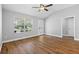 Bright living room with vaulted ceilings, a ceiling fan, a window, and new flooring at 449 Timmonsville Way, The Villages, FL 32162
