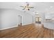 Spacious living room with modern flooring and vaulted ceilings, creating an open and airy atmosphere at 449 Timmonsville Way, The Villages, FL 32162