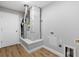 Utility room showcases modern HVAC unit, hardwood floors, and convenient dryer hookups at 449 Timmonsville Way, The Villages, FL 32162