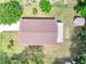 Aerial view of the house showcasing the roof, backyard, driveway, and shed at 458 Spring Ln, Ocala, FL 34472