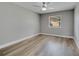 Cozy bedroom featuring light wood flooring, neutral walls and a window at 458 Spring Ln, Ocala, FL 34472