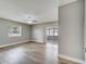Bright bedroom with light wood flooring, ceiling fan, window, and sliding glass doors to the balcony at 458 Spring Ln, Ocala, FL 34472