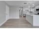 Updated kitchen features white cabinets, stainless steel appliances and breakfast bar, perfect for entertaining at 458 Spring Ln, Ocala, FL 34472