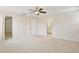 Bright bedroom featuring neutral walls and carpet, and multiple entryways, enhancing the spaciousness of the room at 4901 Stone Acres Cir, St Cloud, FL 34771