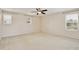 Spacious bedroom with neutral carpet and multiple windows, offering ample natural light and a serene atmosphere at 4901 Stone Acres Cir, St Cloud, FL 34771