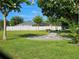 Community dog park with benches and watering station surrounded by lush green space at 4901 Stone Acres Cir, St Cloud, FL 34771
