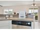 Kitchen featuring tile flooring, counter seating, and sliding doors that provide natural light at 4901 Stone Acres Cir, St Cloud, FL 34771