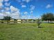 Beautiful lake view surrounded by lush green grass at 4901 Stone Acres Cir, St Cloud, FL 34771