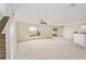 Spacious living area featuring carpet, large window, and sliding door to the outside area at 4901 Stone Acres Cir, St Cloud, FL 34771