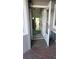 Entryway with an open doorway looking into the living room, revealing hardwood floors at 525 Oak Ter # 117, Altamonte Springs, FL 32701
