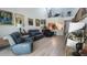 Living room featuring high ceilings, laminate floors, and modern furniture and decor at 525 Oak Ter # 117, Altamonte Springs, FL 32701
