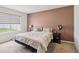 Comfortable bedroom with a neutral color scheme and a large window at 585 Talisi Loop, St Cloud, FL 34771